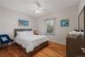 Bedroom with light wood-type flooring and ceiling fan