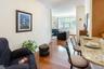 Dining area featuring hardwood / wood-style floors, crown molding, and baseboards