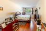 Bedroom featuring ornamental molding and hardwood / wood-style floors