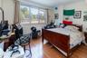 Bedroom featuring hardwood / wood-style floors and ornamental molding