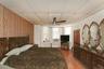 1st Floor Bedroom with a paneled ceiling, light wood-type flooring, ceiling fan, and wooden walls