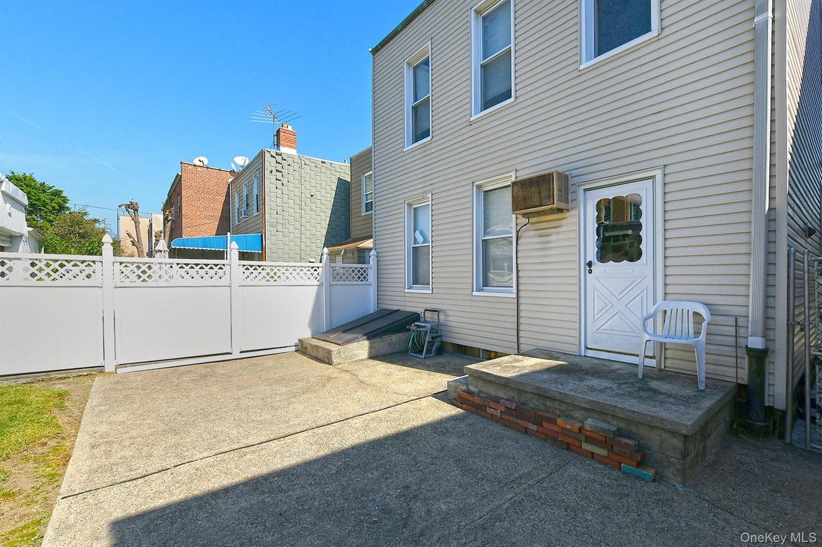 Rear view of house with a patio area and a residential view