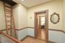 Hallway featuring light wood-style floors and radiator