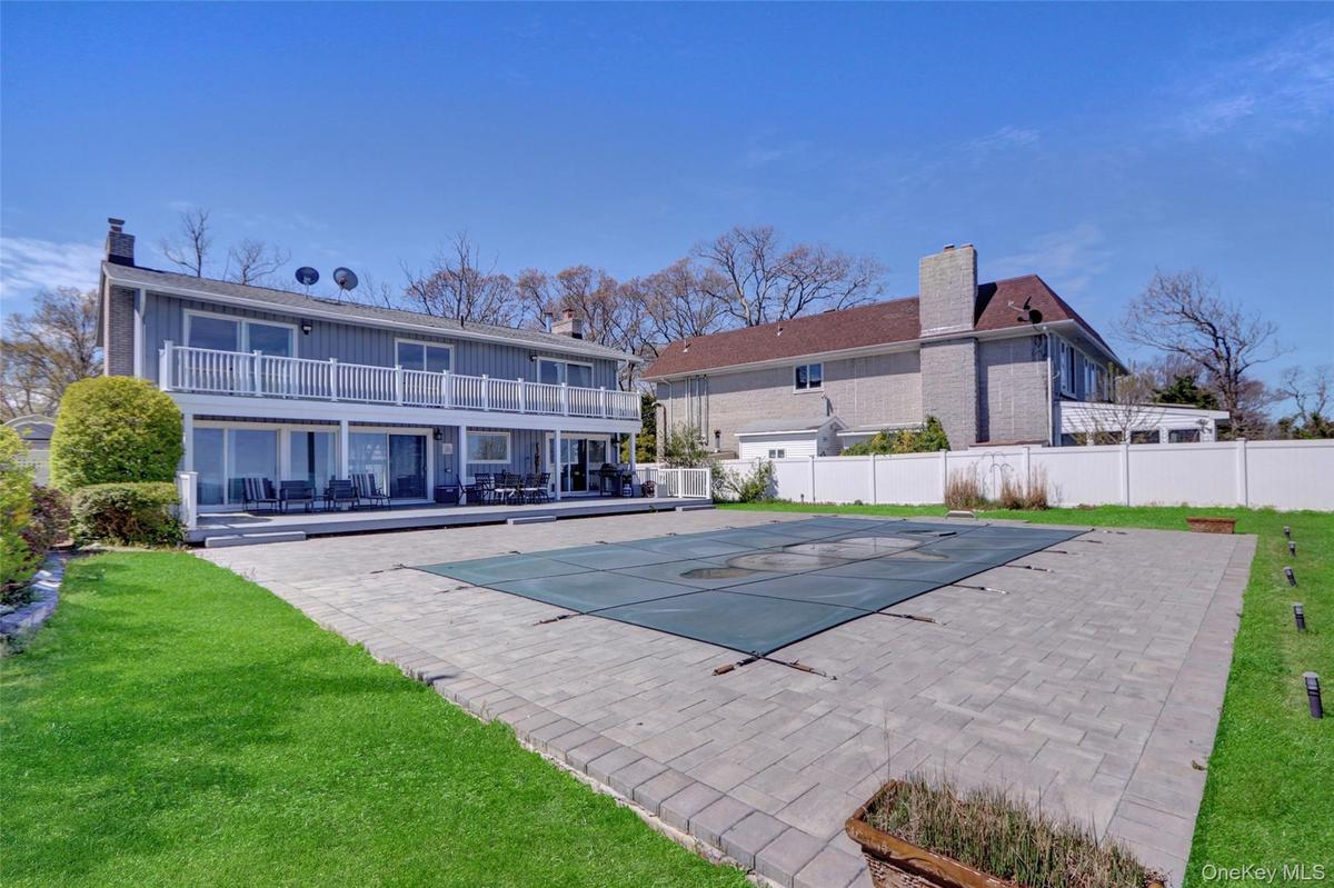 View of swimming pool featuring a patio and a balcony