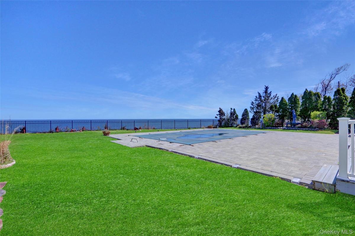 View of property's community with a fenced backyard and a pool