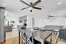 Dining room featuring light wood-type flooring, ceiling fan, and recessed lighting