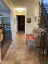 Corridor featuring crown molding and baseboards