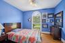 Inviting bedroom offering a seamless connection to a private full bathroom for added comfort and convenience.