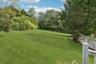 Rear view of the home featuring a fenced backyard.
