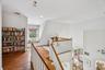 A beautifully crafted built-in library on the second level, designed to complement the home’s sophistication and charm.