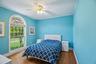 Spacious bedroom with a private full bathroom en suite.