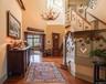 Dramatic foyer with custom staircase