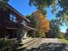 View of side of property featuring a patio area