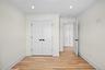 Unfurnished bedroom with light wood-type flooring, ornamental molding, a closet, and recessed lighting