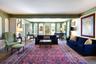 Living area featuring crown molding