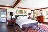Bedroom, crown molding, wood floors, en suite large bathroom