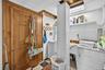 Washroom with washer / dryer, tile walls, and an ornate ceiling