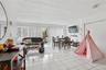 Living room with light tile patterned floors and a textured ceiling
