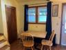 Dining room featuring radiator and dark wood-type flooring
