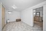 Unfurnished bedroom with a closet and baseboards