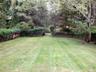 Expansive lawn for outdoor activities and games. A perfect croquet or badminton area.