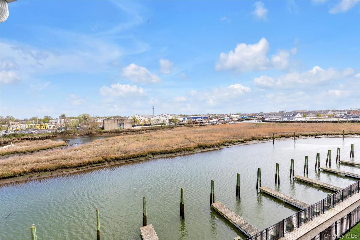 Dock area featuring a water view