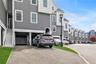 View of front of home with asphalt driveway and a residential view