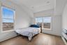 Bedroom featuring baseboards and wood finished floors