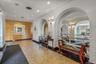 Building lobby featuring a textured ceiling, recessed lighting, and a textured wall