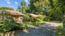 View of front of house featuring driveway and brick siding