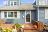 Property entrance featuring roof with shingles