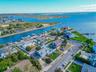 Aerial perspective of suburban area with a large body of water