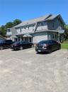 View of front of home featuring a shingled roof