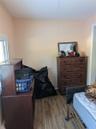 Bedroom with light wood-type flooring