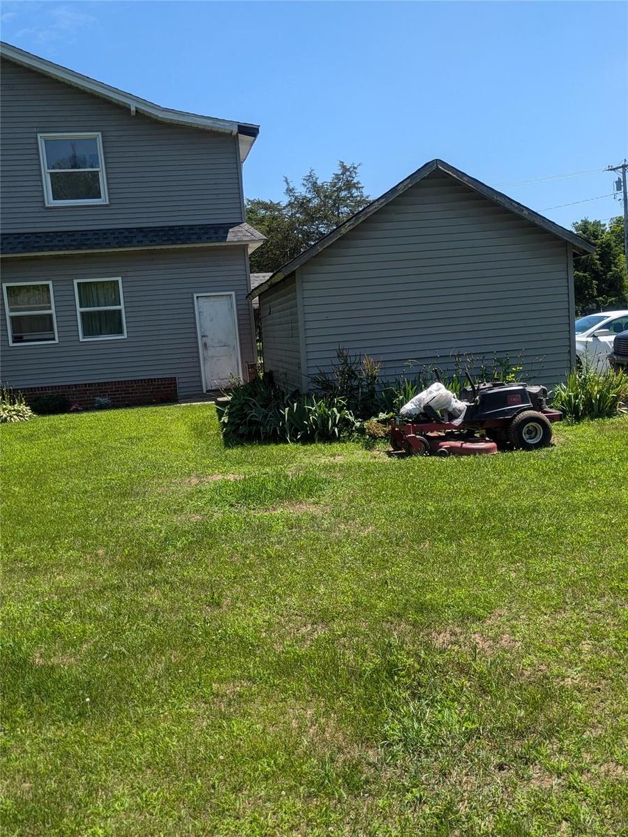 View of home's exterior with a lawn