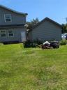 View of home's exterior with a lawn