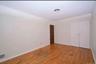 3rd floor bedroom featuring light wood-style flooring, ornamental molding, and a closet
