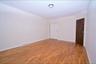 3rd Floor bedroom with light wood-type flooring and baseboards