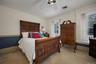 Bedroom with carpet floors and a ceiling fan