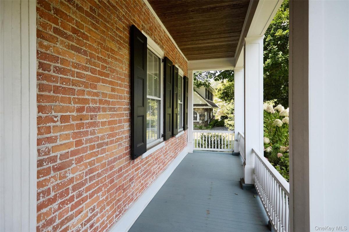 Covered porch with a sunroom