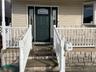 Property entrance with a porch
