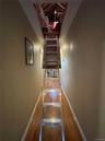 Staircase featuring wood-type flooring and baseboards