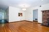living room featuring wood finished floors, recessed lighting, and a chandelier
