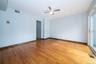 Spare room with light wood-style floors and ceiling fan