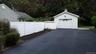 Detached garage featuring asphalt driveway