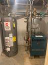 Utilities featuring water heater and a heating unit