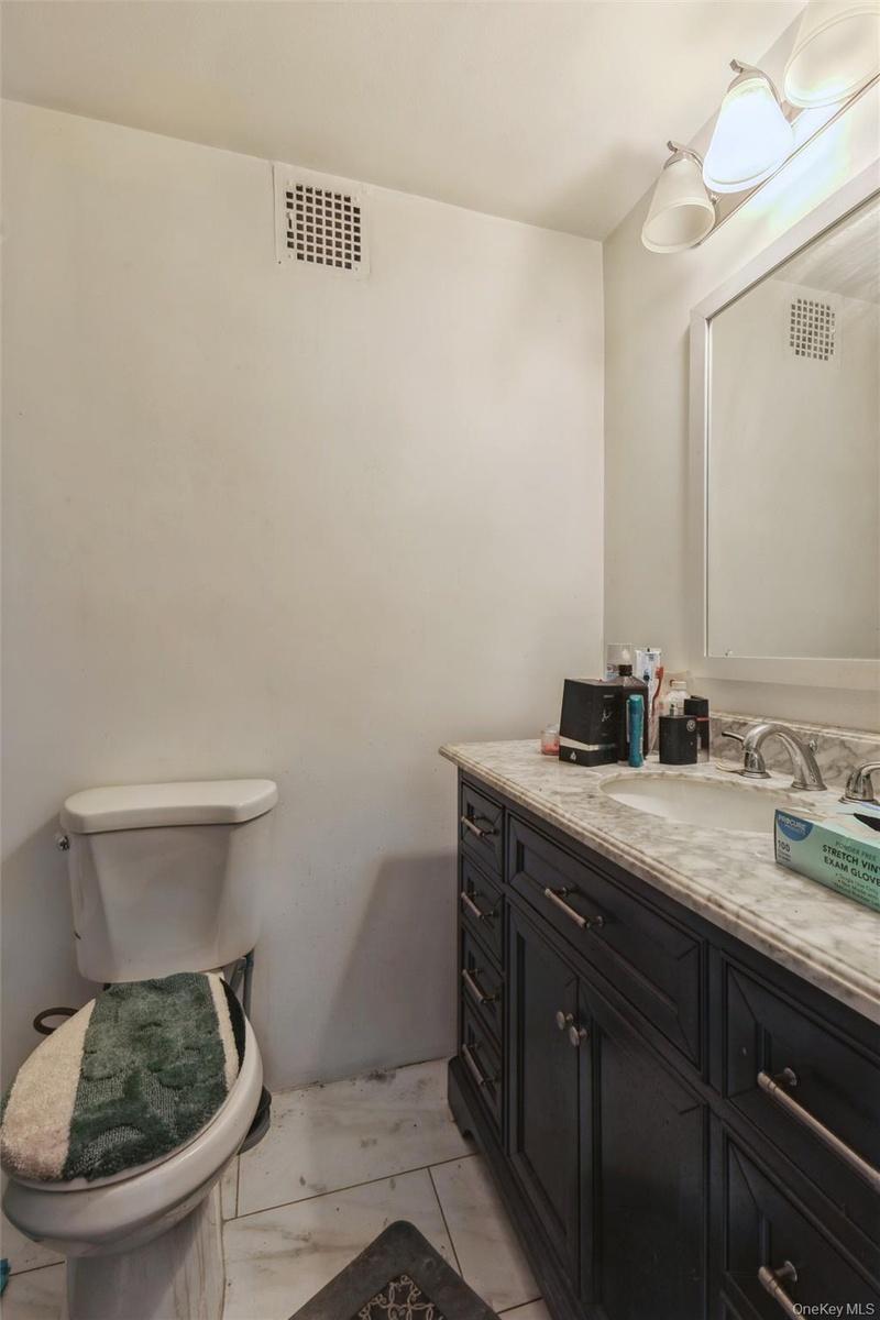 1st Floor full bathroom with vanity and toilet