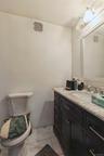 1st Floor full bathroom with vanity and toilet