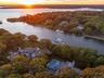 Aerial view at dusk of a forest view and a water view