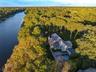Aerial view of a forest and a large body of water